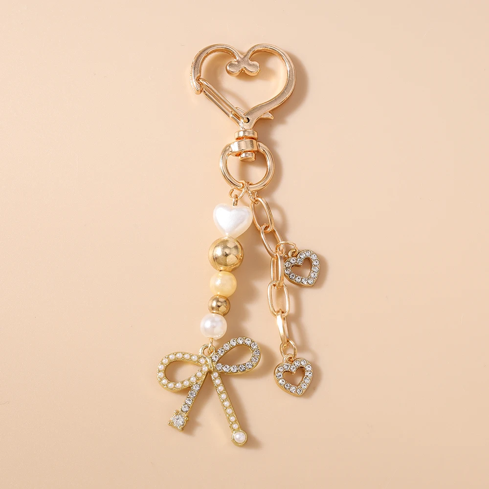 Aihua Niedlicher Y2K Metall-Herz-Blumen-Schleifen-Schlüsselanhänger mit Perlen für Damen und Mädchen, Handtaschenanhänger, DIY handgemachter Schmuckzubehör – Detail 6