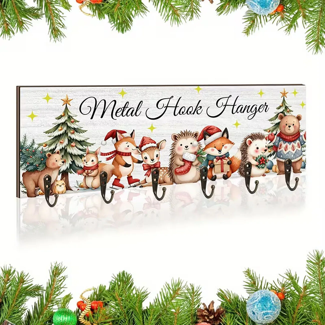 White wooden stocking hanger with forest animal print, six metal hooks, lovely festive wall decor for Christmas.