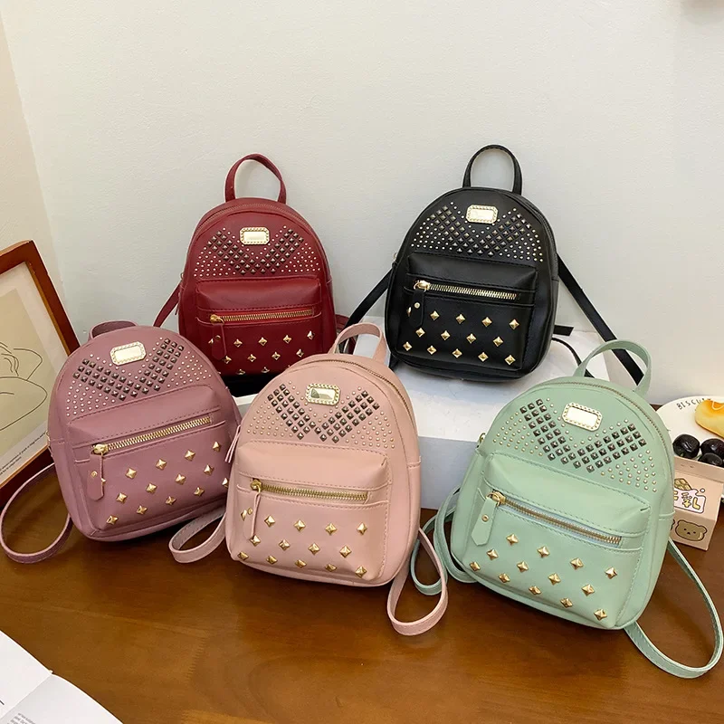 Guangzhou foreign trade women\'s bag 2024 Korean version of the new rivet decorative backpack large small schoolbag backpack