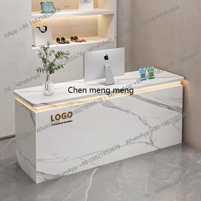 Cashier at the front desk, small bar at the counter of the high-end clothing store