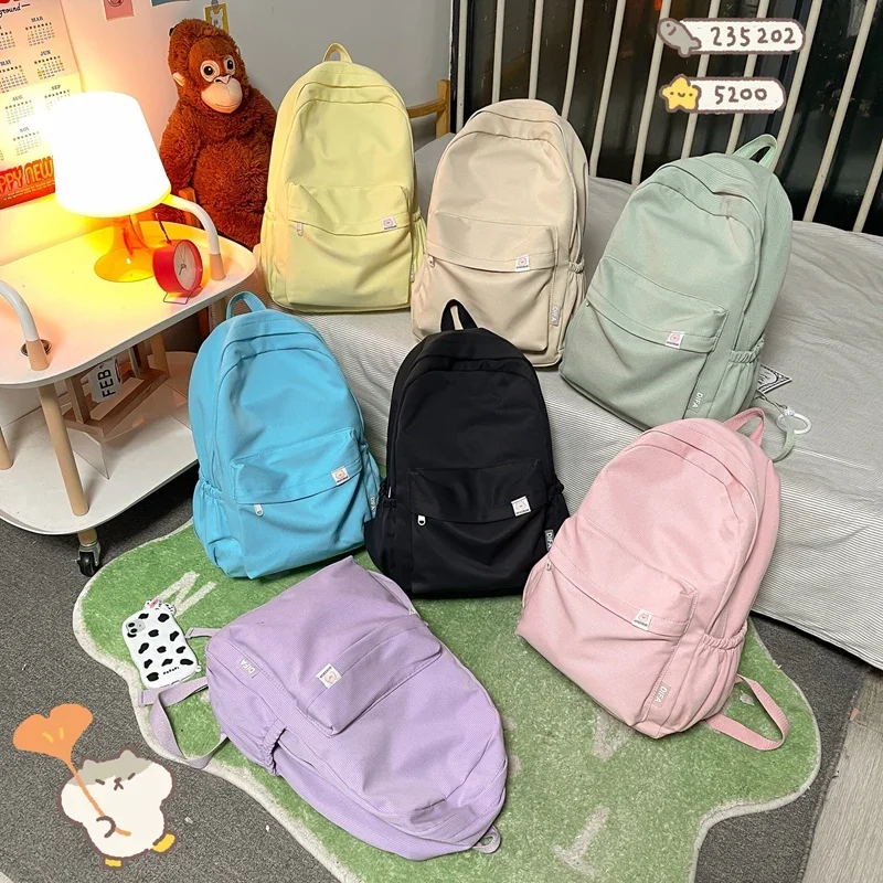 Mochila de nylon impermeável para mulheres, mochila de viagem estilo universitário, mochilas escolares para meninos e meninas adolescentes, monocromática, alta qualidade, nova