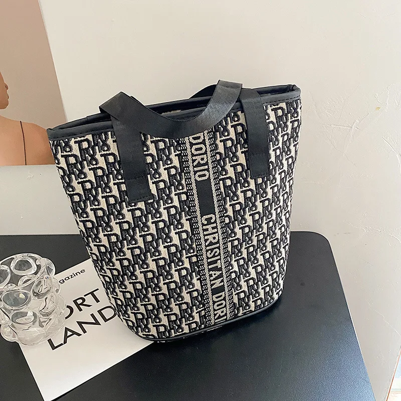 Borsa per cosmetici di grande capacità borsa per la conservazione della borsa per pendolari di moda borsa per lettere in bianco e nero in tela da