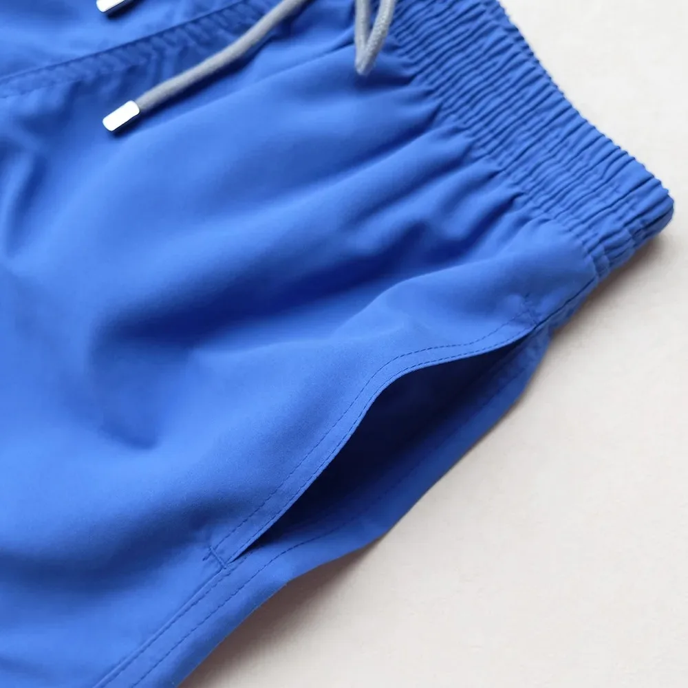 Costumi da bagno magici da uomo di alta qualità cambia colore pantaloncini da Surf reattivi in acqua ricamati Beach Surf Swim Mesh Trunks