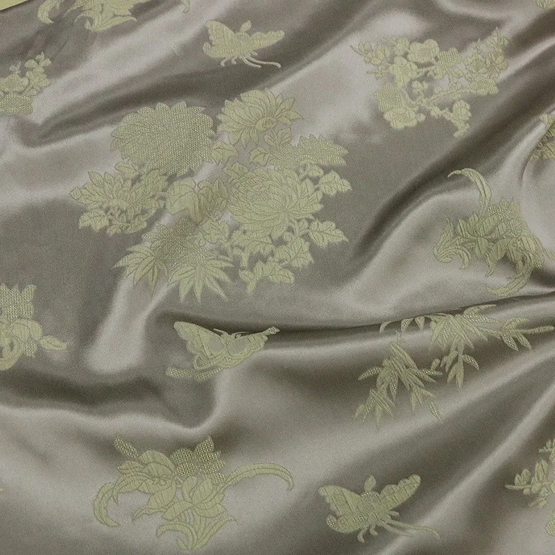 New Chinese-style fabric with embossed pleats made of silk jacquard featuring plum orchid and chrysanthemum