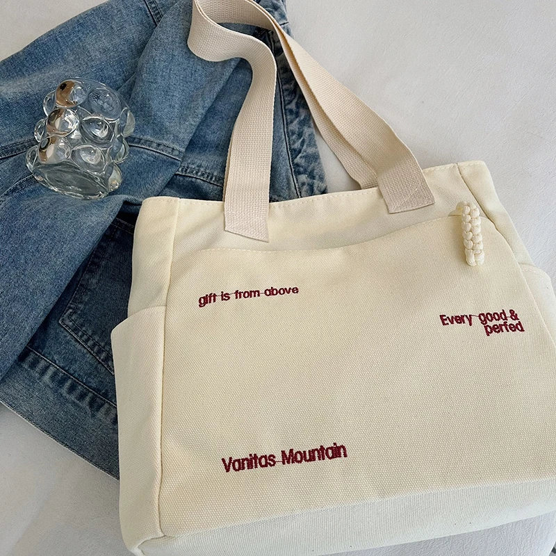 bolsa-de-lona-de-ombro-unico-de-grande-capacidade-para-deslocamento-bolsa-tote-versatil-de-mao-versao-coreana-feminina