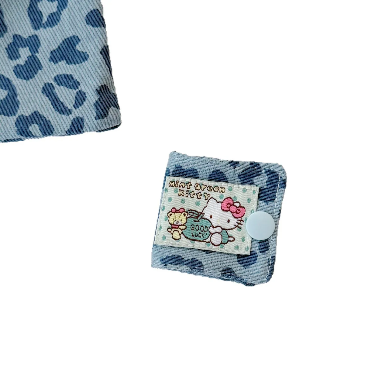 Lindo KT leopardo tela vaquera Cable de datos Clip de almacenamiento hecho a mano Kitty Cable de carga bolsa de almacenamiento cepillo almacenamiento