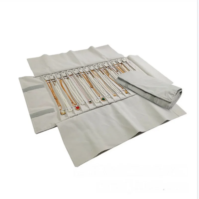

The Jewelry and Accessory Storage Roll Bag Can Hold 16 Necklaces and Is Equipped with A Leather Band To Prevent Tangling