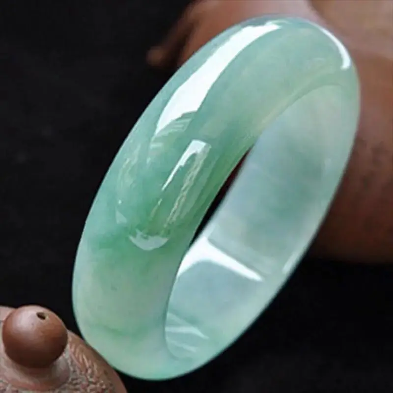 Myanmar natural jade bracelet, old mine, ice-type, light green, with oil-like inclusions, wider design, featuring floating patte