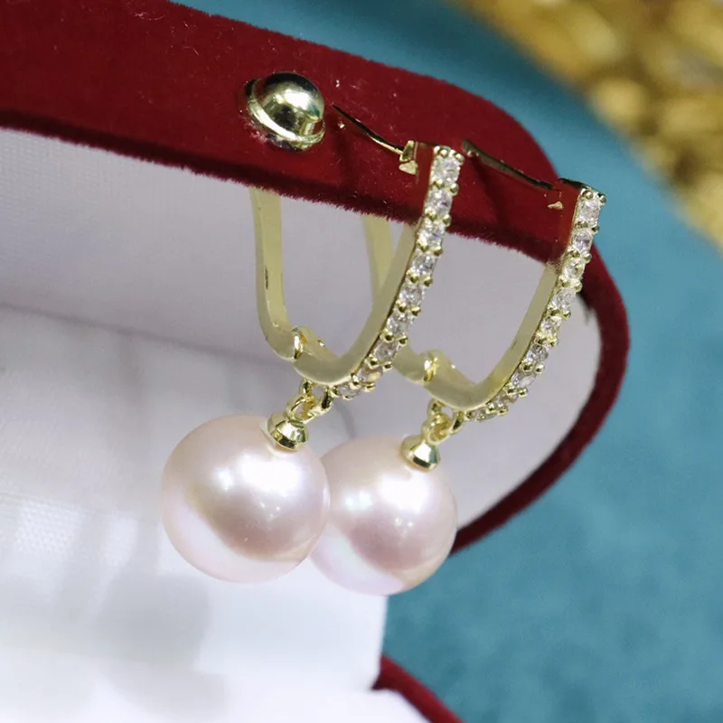 

Серьги-гвоздики с пресноводным жемчугом, женские осенние корейские версии 10-11 мм, нишевый дизайн, модные, простые и элегантные