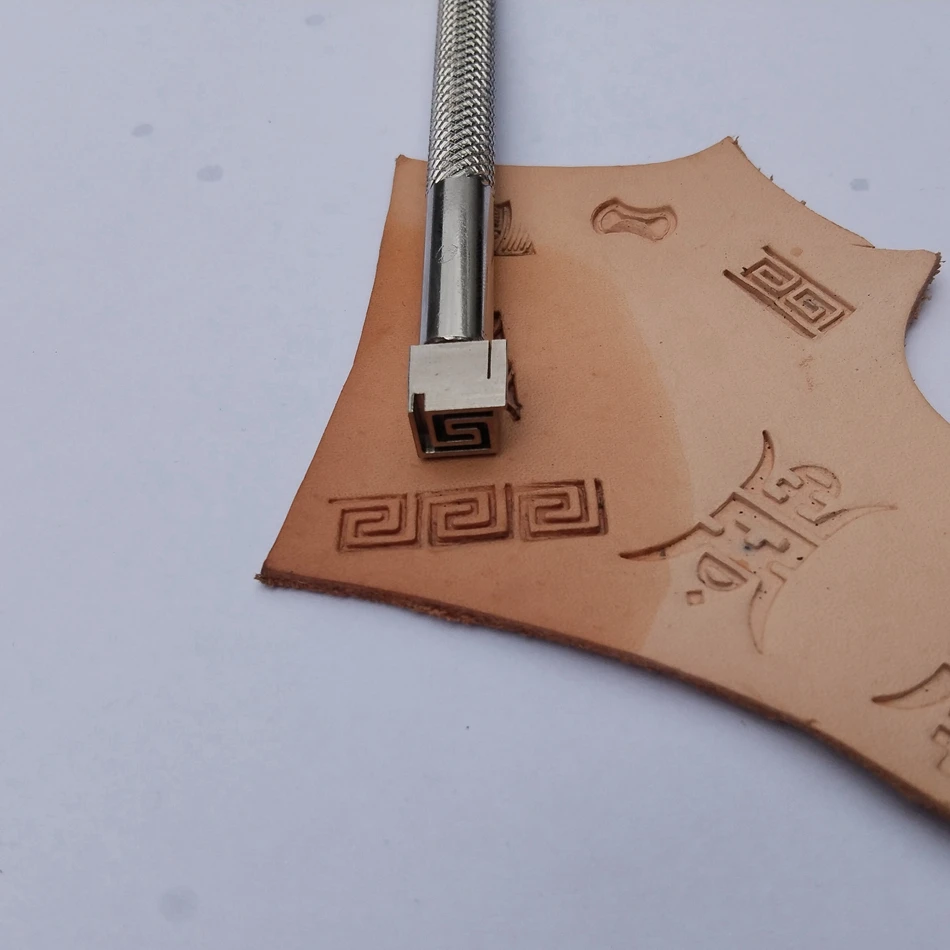 Steel-based precision engraving, leather craftsmanship, hardware, printing, embossing tools, circular frame patterns.