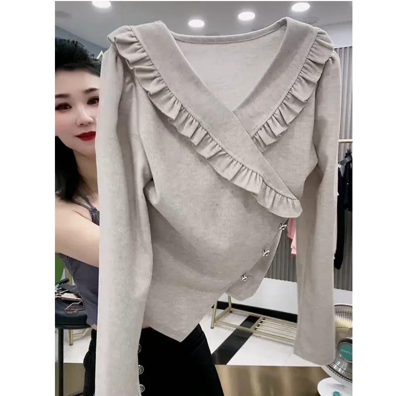 Nuovo stile primaverile e autunnale T-shirt da donna a maniche lunghe con scollo a V irregolare alla moda e versatile