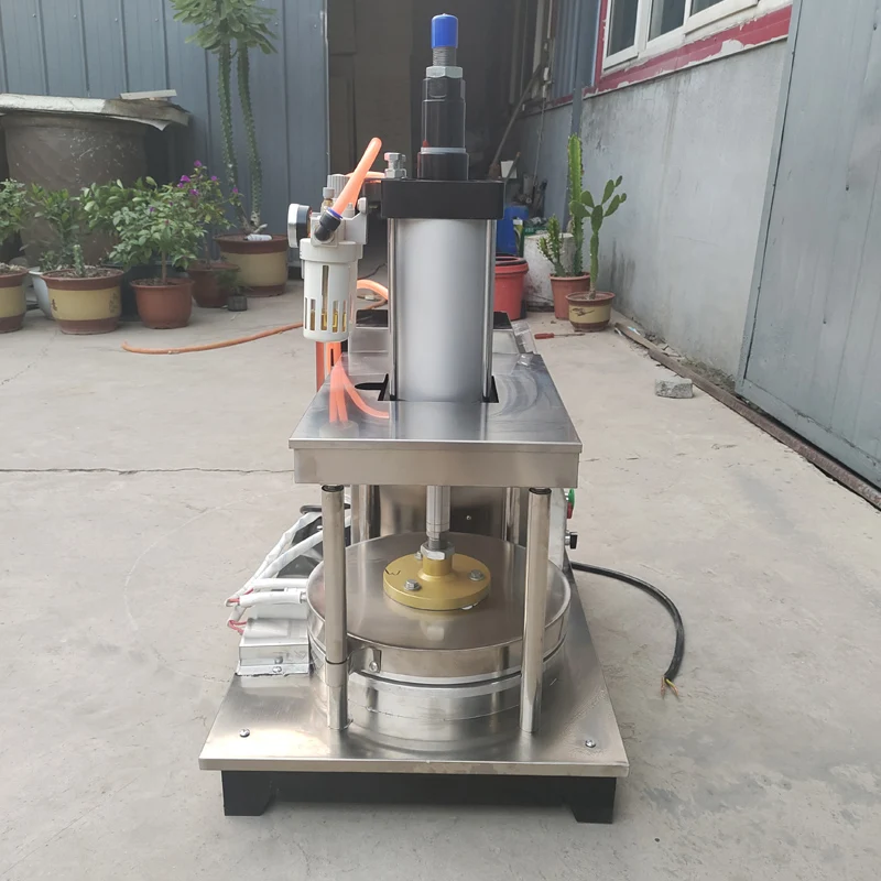 เครื่องทำแพนเค้กเครื่องขึ้นรูปเค้กแบบบางเครื่องรีดแป้งที่อบขนมข้าวสาลีแบบวงกลมเครื่องอัดความร้อน Tortilla roti