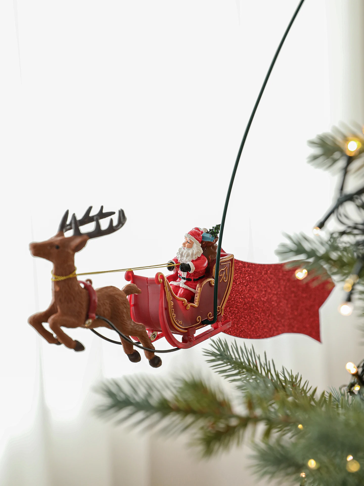 Christmas decorations revolving tree top star Santa pulls cart Christmas tree top moving decorations