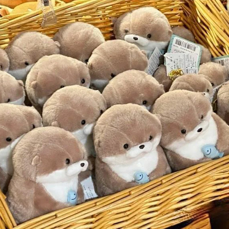 Cartoon Cute Otters Holding Fish bambola di peluche con catena Portachiavi creativi Kawaii Ciondolo appeso Gioielli Borsa da scuola Portafoglio