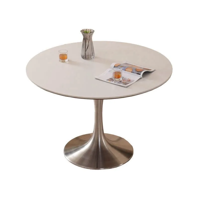 

French travertine rock slab dining table wabi family small apartment dining table round table designer Nordic retro stainless