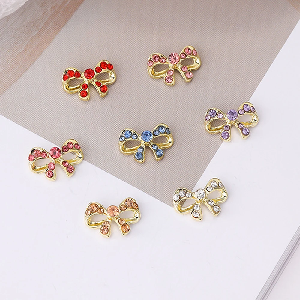 10pcs เพชรริบบิ้นเล็บ Charm 3D หรูหราคริสตัล Hollow ริบบิ้นตกแต่งเล็บ DIY ญี่ปุ่นออกแบบเล็บอะไหล่