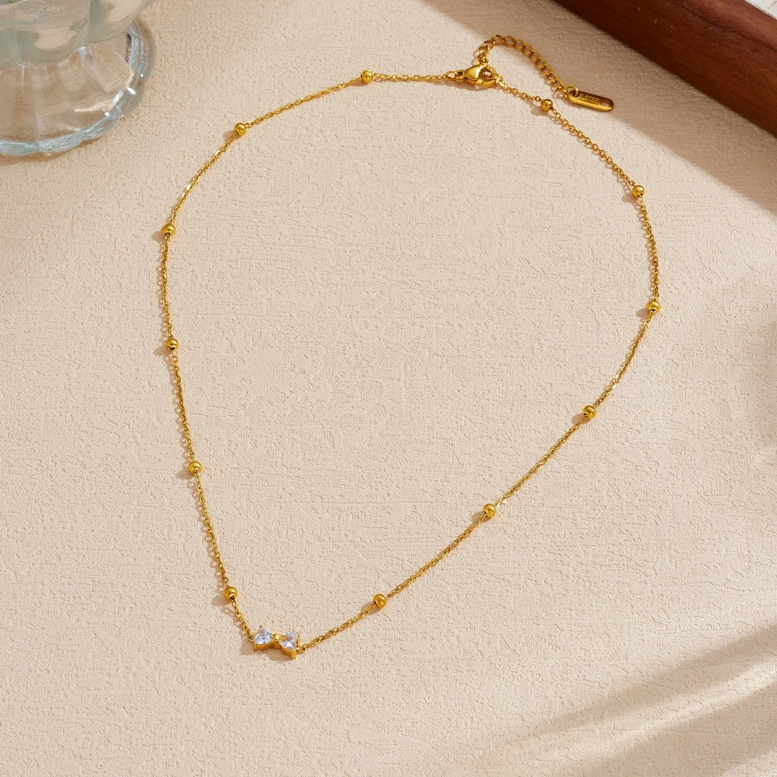 DIEYURO 316L Stainless Steel Simple Bowknot Inlay Zircon Golden Ball Necklace For Women Fashion Waterproof Neck Chain Jewelry view 5