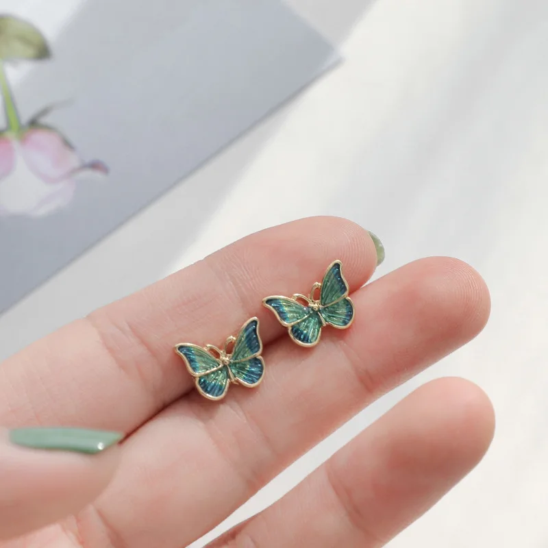 Los fabricantes de pendientes coreanos venden pendientes de mariposa de estilo de pintura al óleo suaves y flexibles, nuevos pendientes versátiles