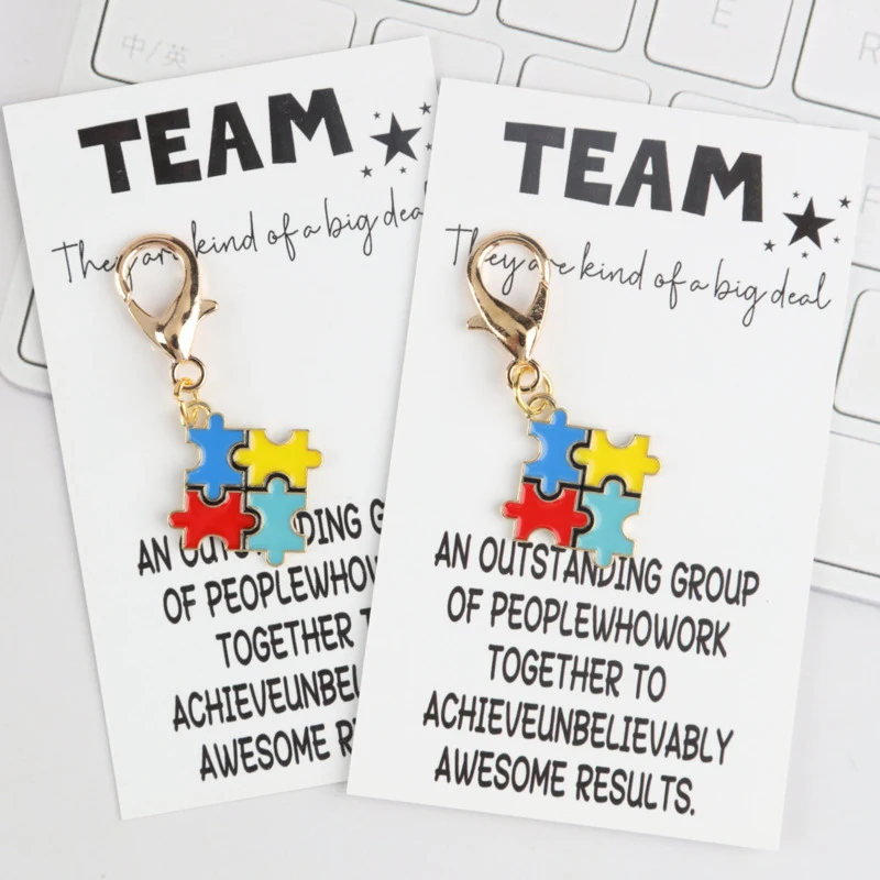 8/12pcs Interesting Puzzle Series Keychain Set Attached is a card stating that you are an indispensable member of our team Encou