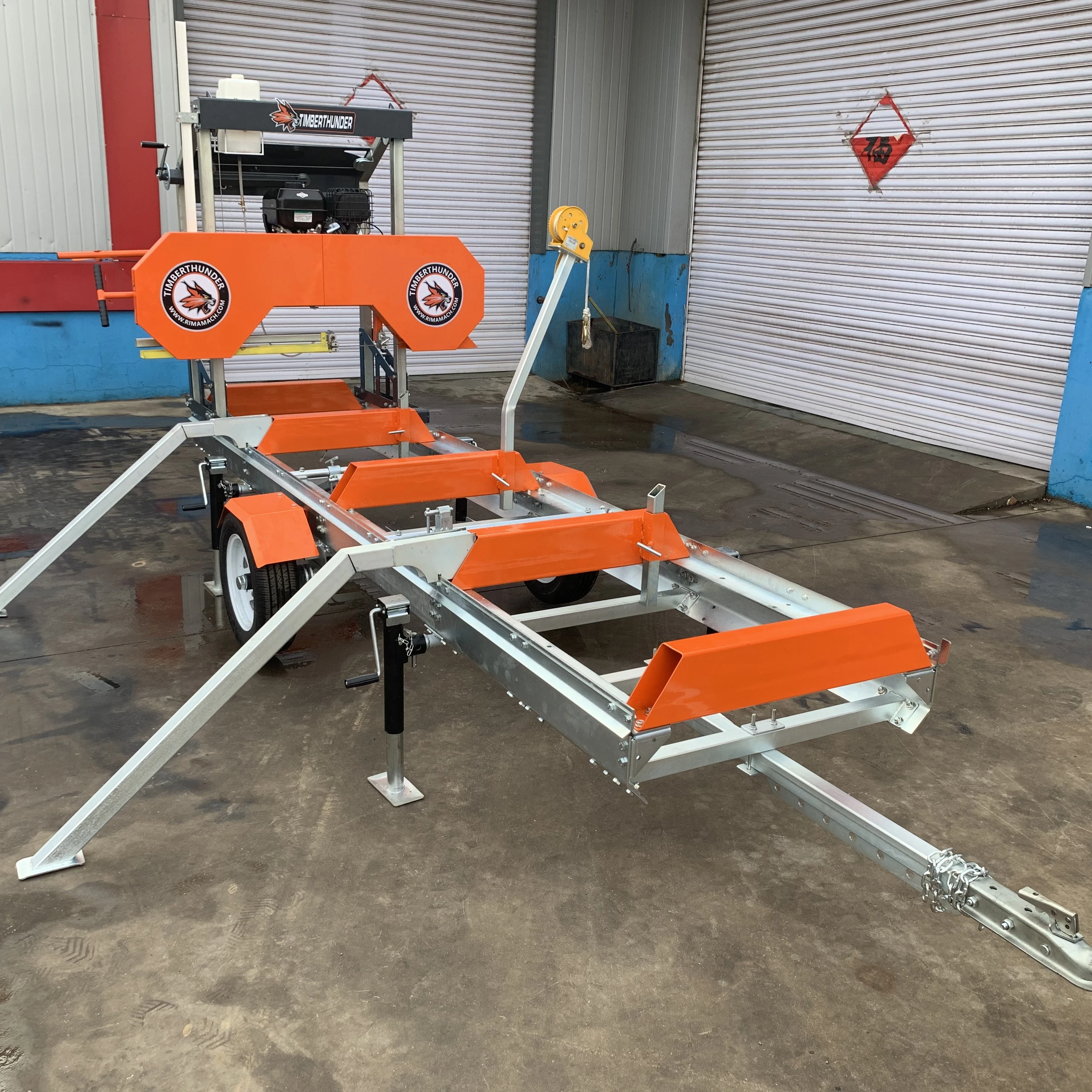 

Portable bandsaw woodworks with a 15hp gasoline engine