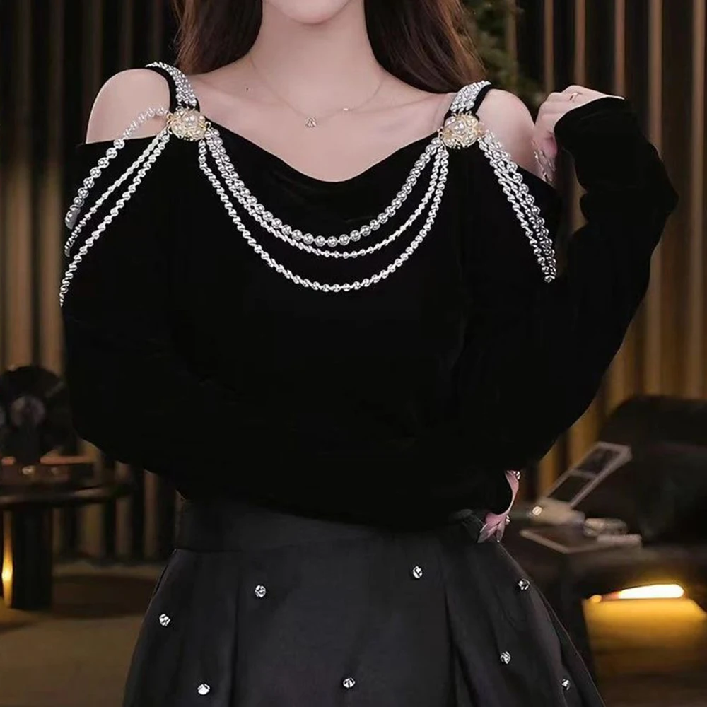 الفرنسية الصغيرة عبق نمط الأزياء حبة تصميم خارج الكتف طويلة الأكمام تي شيرت 2025 الخريف جديد رقيقة أعلى الإضافية