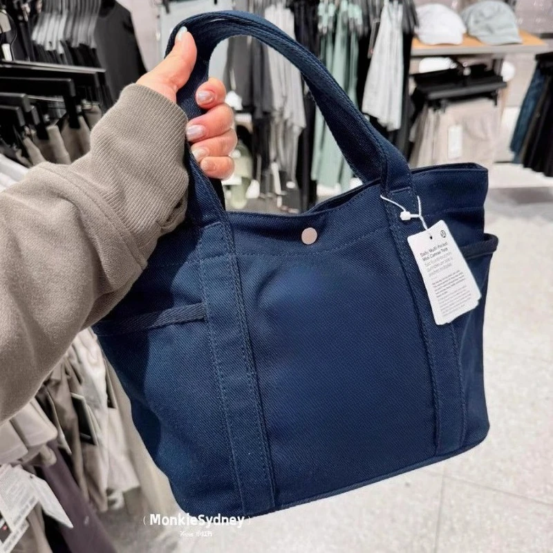 

Horizontal canvas portable student handbag, large capacity, carried by a single initiative, cross carried, urban minimalism