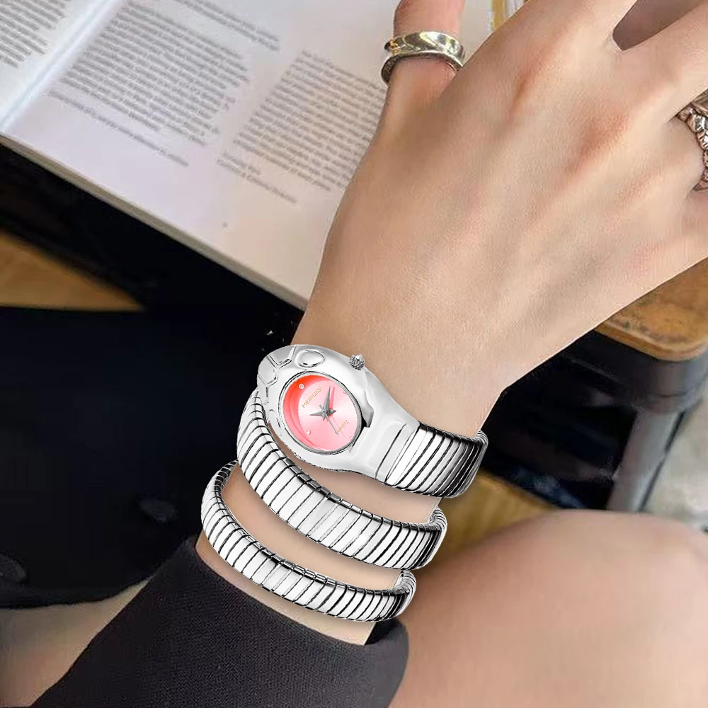 A ladies' pink snake shaped strap elegant, casual, unique, trendy and personalized quartz watch graduation season gift