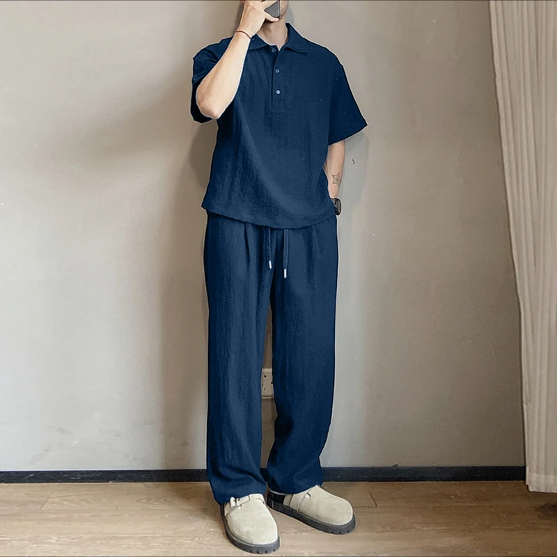 

INCERUN Мужские комплекты Однотонная рубашка с короткими рукавами и брюки с лацканами Комплекты из двух предметов Свободная уличная одежда 2025 Мужские повседневные костюмы S-5XL