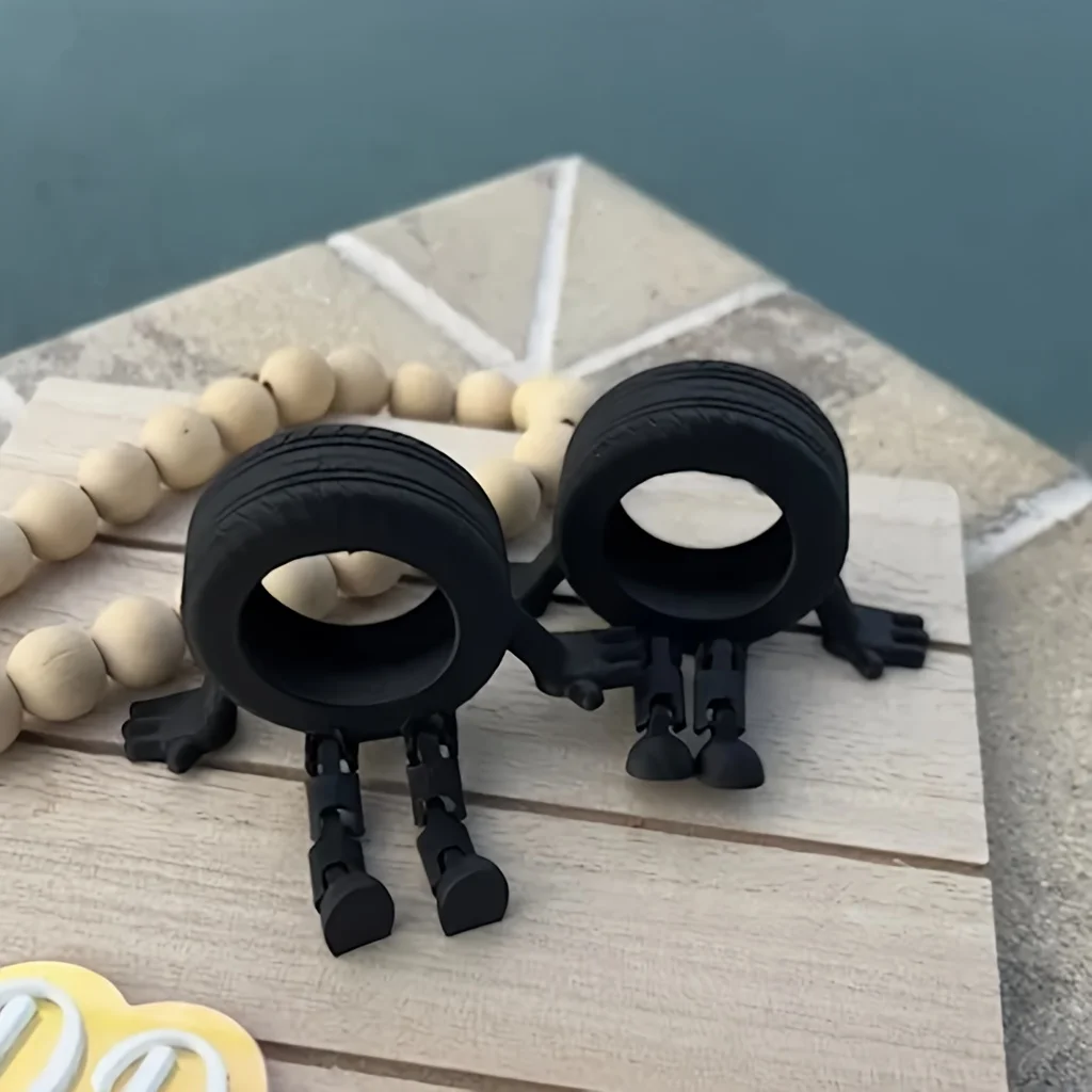 

Cute Tyre Sculpture With Durable Plastic 3D Printed Movable Joints Wheels Decoratio