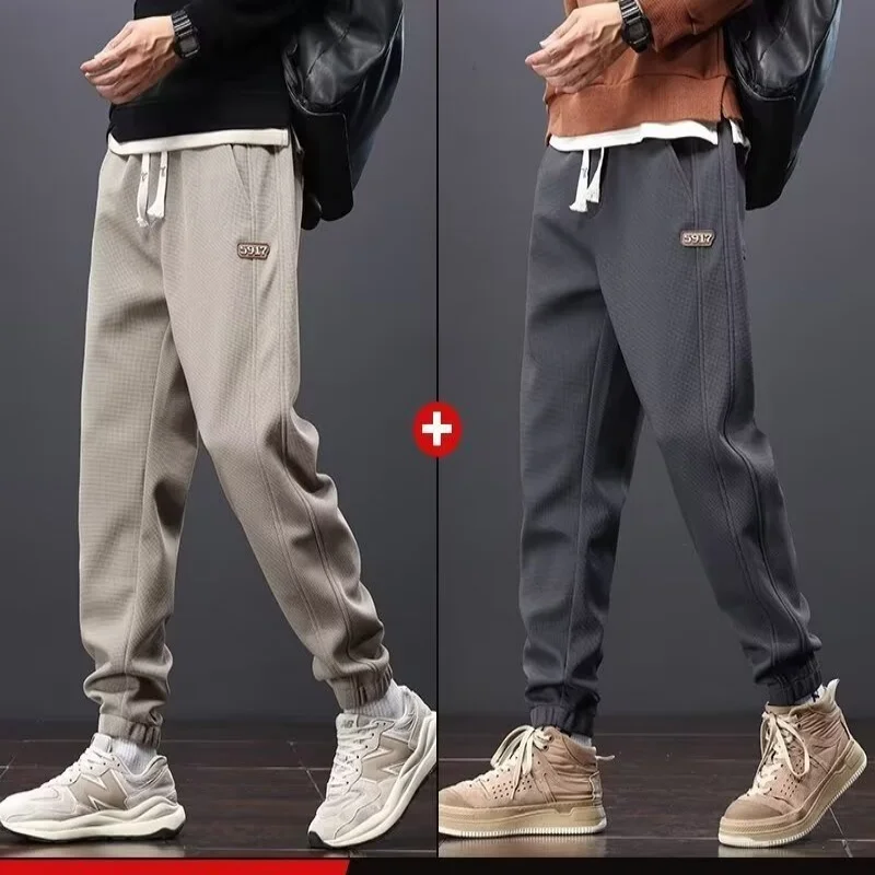 Casual pants men's 2026 autumn and winter new trendy brand plus velvet sanitary pants, loose leg binding sports pants