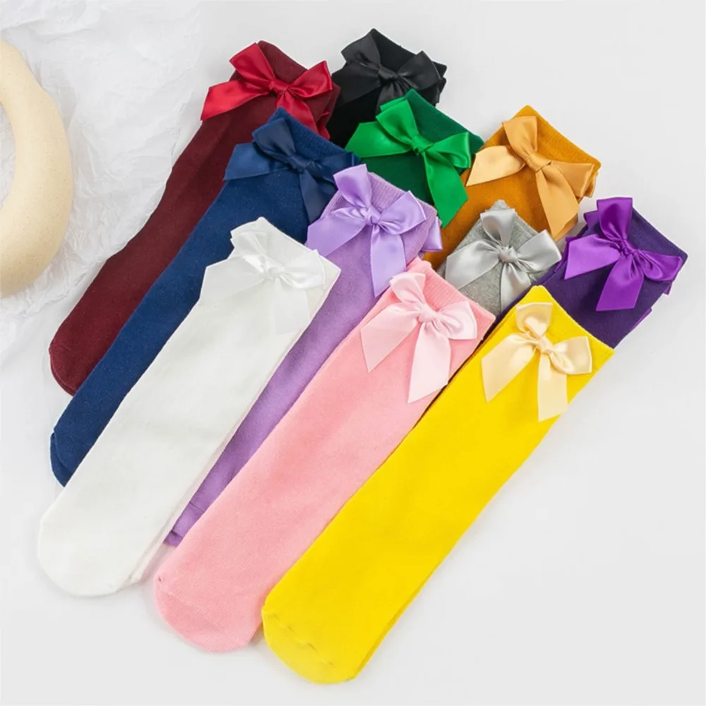 Solid color bow children's stockings straight tube without heel size children's socks Candy-colored girls pile socks.