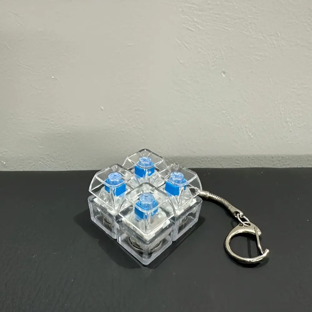 Sturdy Plastic Material Fingertip Button Keychain Bright RGB Ambient Lights Delicate Glowing Effects Mechanical Switch Keychain