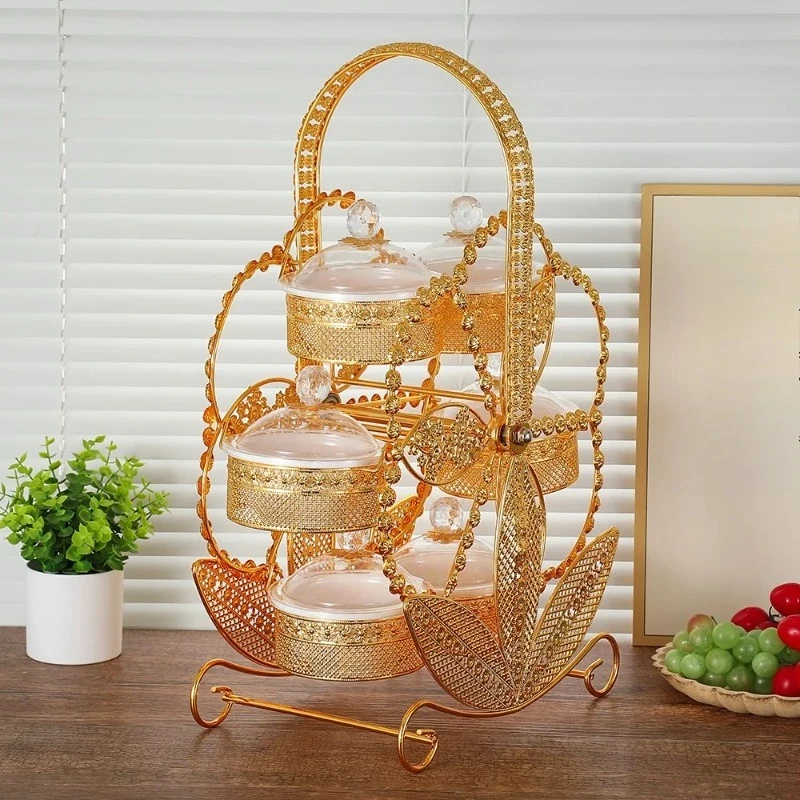 Squisito piatto di frutta acrilico in ferro battuto di fascia alta, mulino a vento creativo, vassoio rotante per snack, piatto di frutta per soggiorno, festa