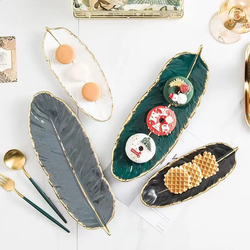 

Nordic Ceramic Gold Plating Tray Leaf Feather Shape Fruit Cake Plate Desktop Jewelry Cosmetic Organizer Living Room Table Decor