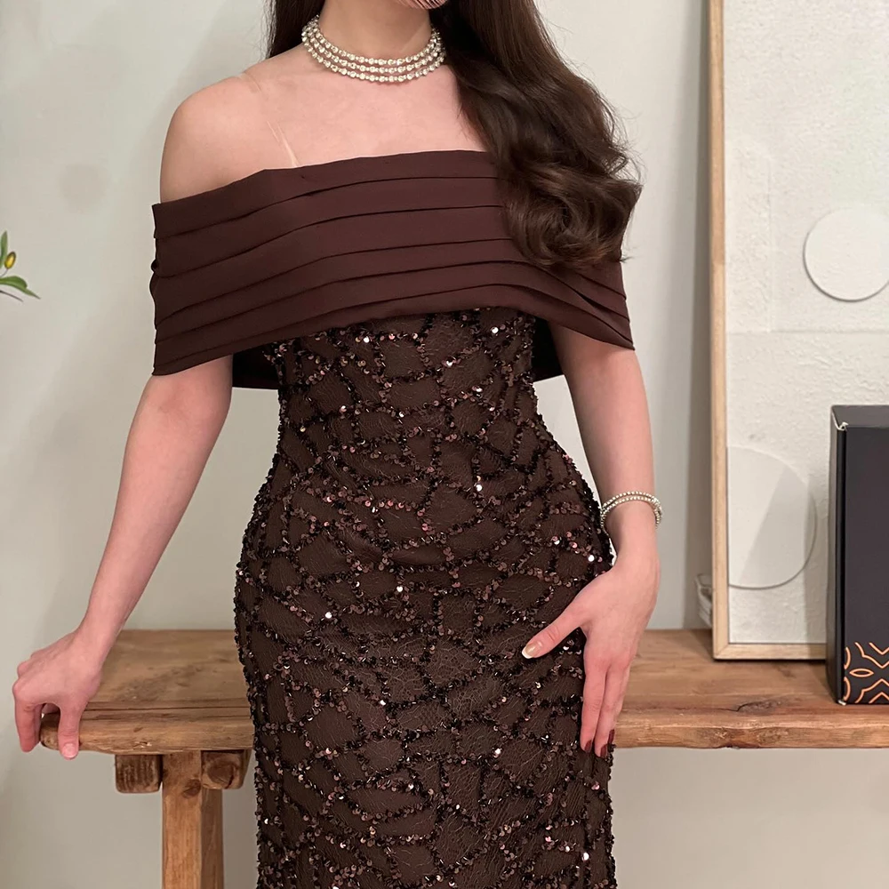 ชุดราตรีทรงเอไลน์แบบสั่งตัด ยาวกรอมพื้น แบบเปิดไหล่ ไม่มีแขน ชุดออกงานพรอม แฟชั่นประดับเลื่อม จับจีบด้านหลัง เปิดหลัง ชุดงานเลี้ยง