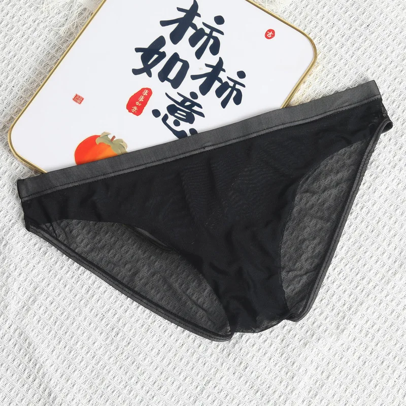 Solid-colored thin transparent mesh ice silk underpants, breathable and fashionable low-waisted triangular pants for young men