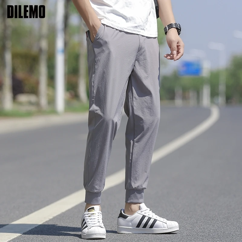 

High Quality New Brand Casual Fashion Elastic Strappy Long Pants Jogger Pencil Teens Quick Dry Slim Fit Trousers Men Clothes