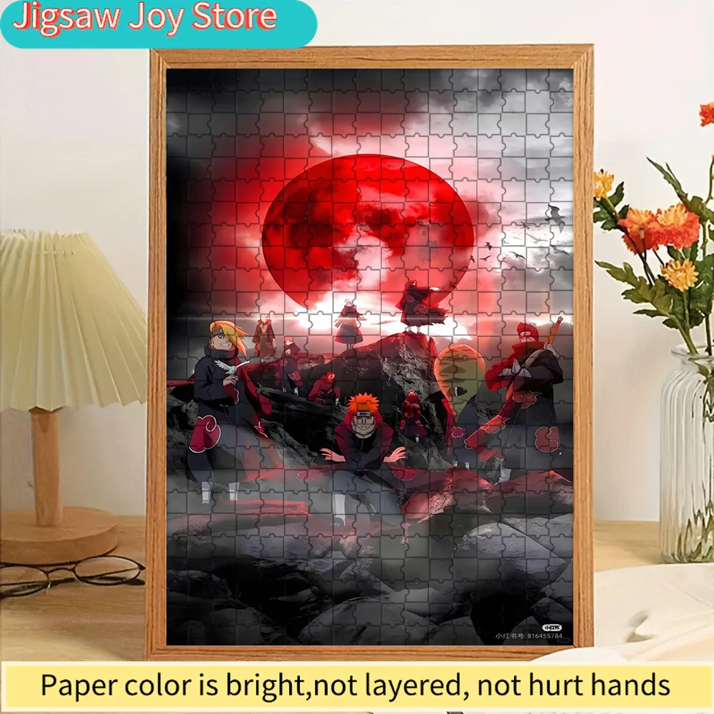 

Akatsuki Clan Paper Puzzle, Epic Naruto Anime Art of Akatsuki Members with a Red Moon Background, Premium Paper Jigsaw for Stres