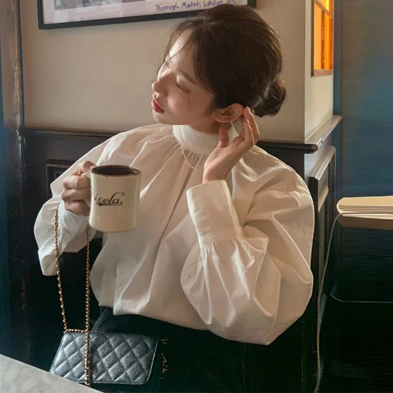 세련된 미니멀리스트 여성 셔츠 랜턴 슬리브 루즈핏 스탠드 칼라 싱글 버튼 디자인 한국 스타일 긴 소매 탑