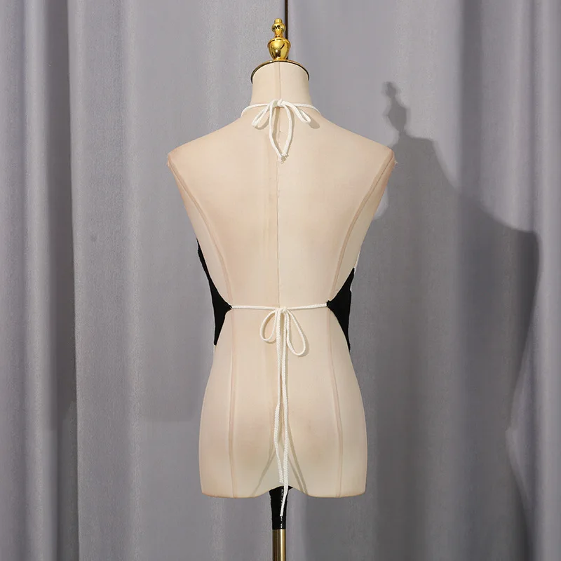 Canotta in maglia a righe diagonali con orlo asimmetrico Canotta estiva da donna senza maniche Slim Halter Backless Canotte sexy Canotte minimaliste