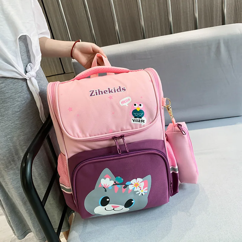 Student backpacks 2023 new cartoon space bags 1st to 3rd grade elementary school students fashion British style backpacks trend