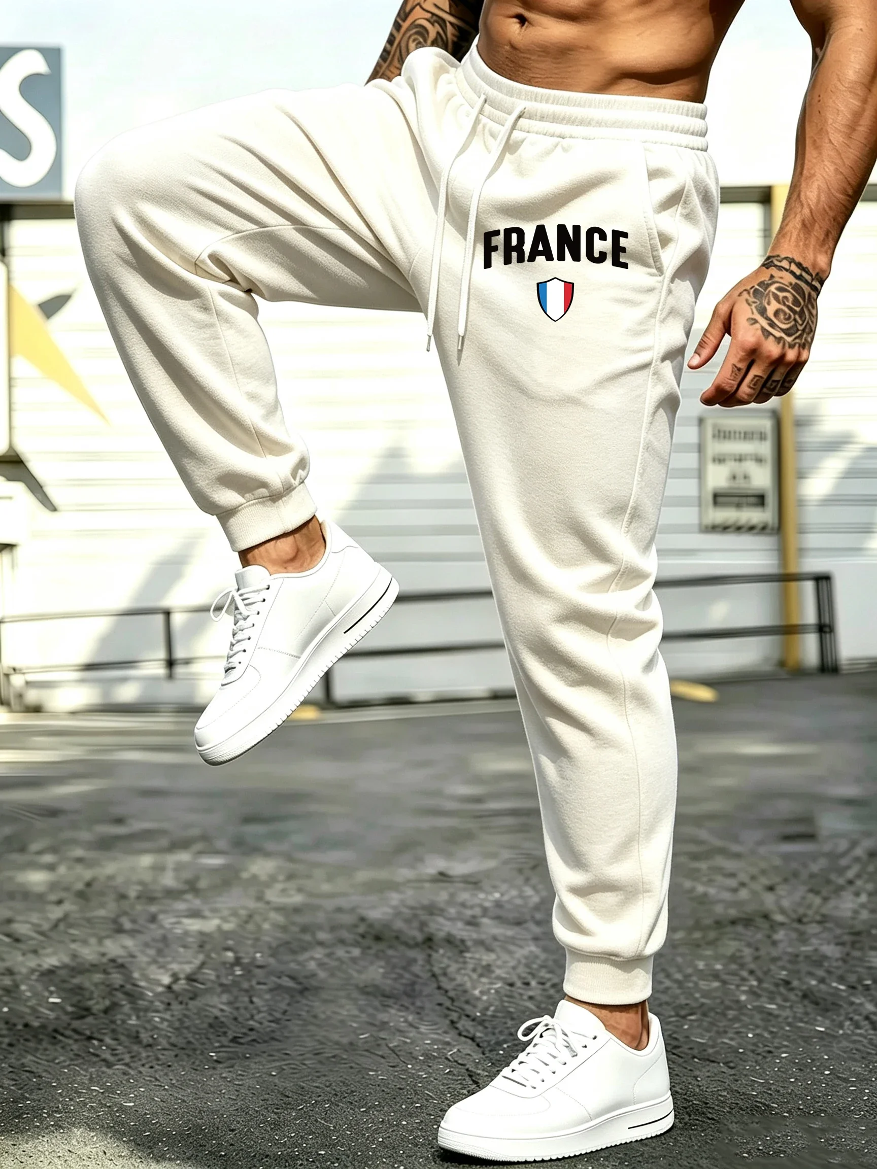 Men's casual jogging pants, featuring French letter print, pockets, and a drawstring design for a simple and versatile look.