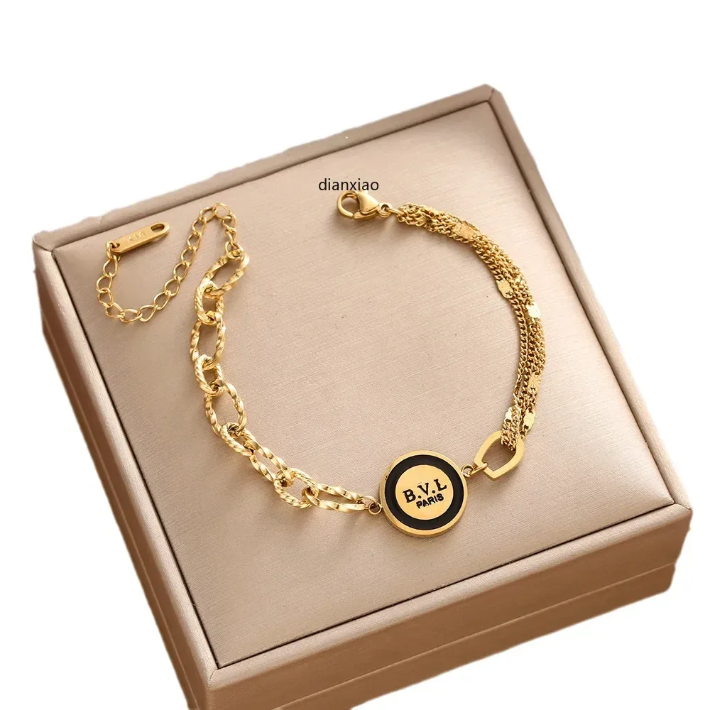 

This new popular OL letter Bvl black hollowed-out pattern multi-layer asymmetrical bracelet