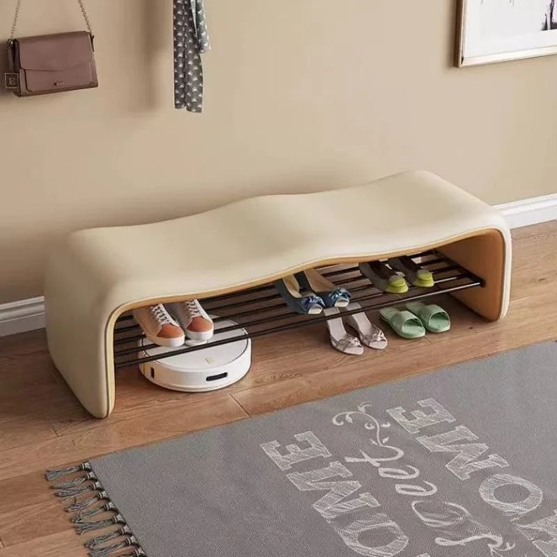 Home entryway shoe bench with a wave-shaped design and a minimalist, high-end feel, integrated shoe rack that can be sat on