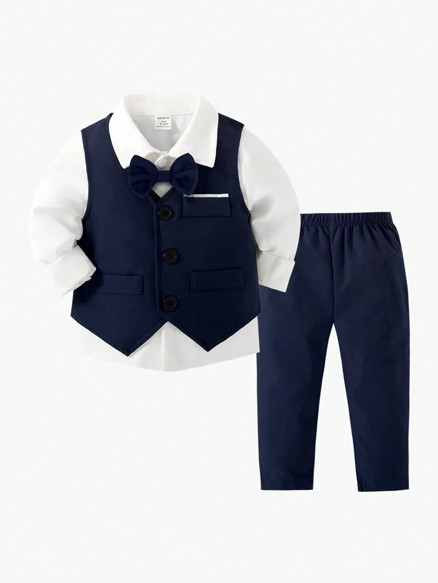

Набор из 2 предметов для мальчика: темно-синий жилет из твила с галстуком-бабочкой и брюки в тон.