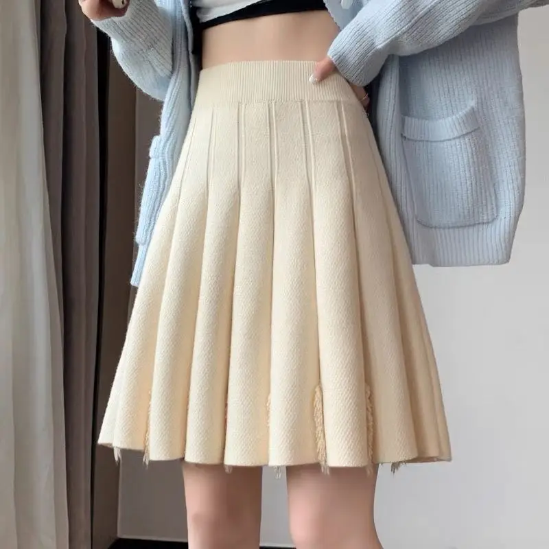 Temperament Jesień/Zima Damska solidna frędzle Elastyczna wysoka talia Koreański styl Preppy Wąska krótka plisowana spódnica z dzianiny o linii A