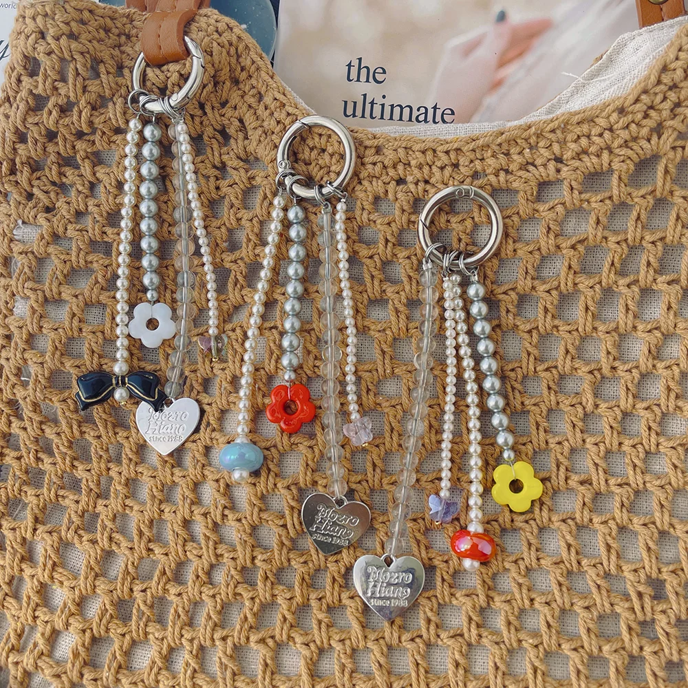 Original new product: simple pearl flower butterfly heart bow niche phone bag accessory keychain
