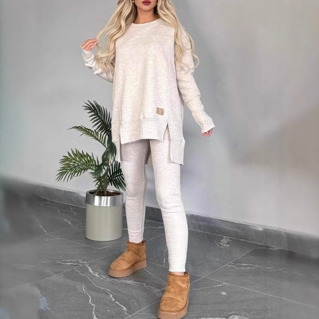

2026 European and American autumn and winter popular women's clothing top slit long sleeve round neck casual solid color German