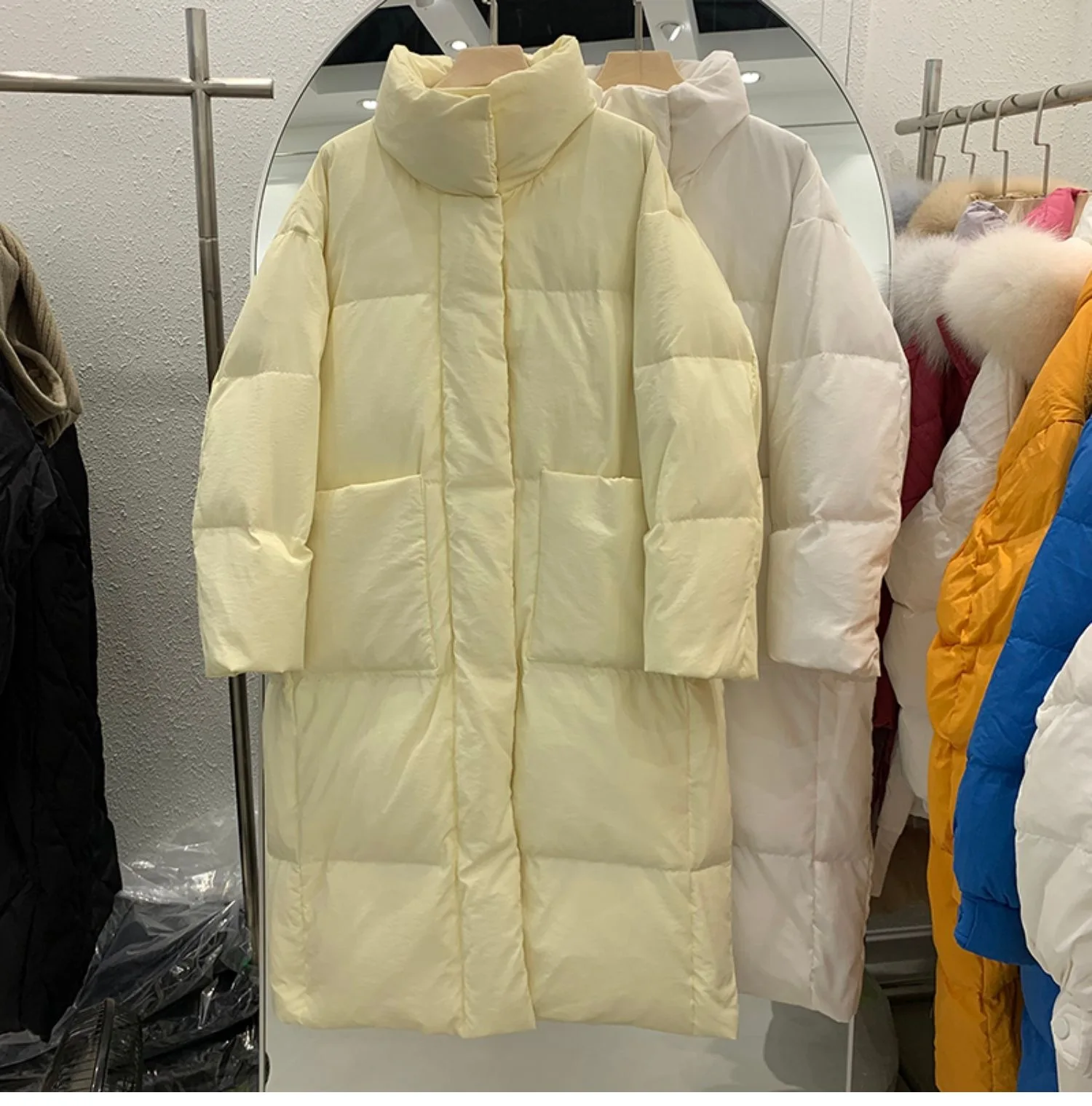 

New Solid Mid Length Down Coat Women's Korean Edition Thickened Standing Neck Large Pocket White Duck Down Bread Coat