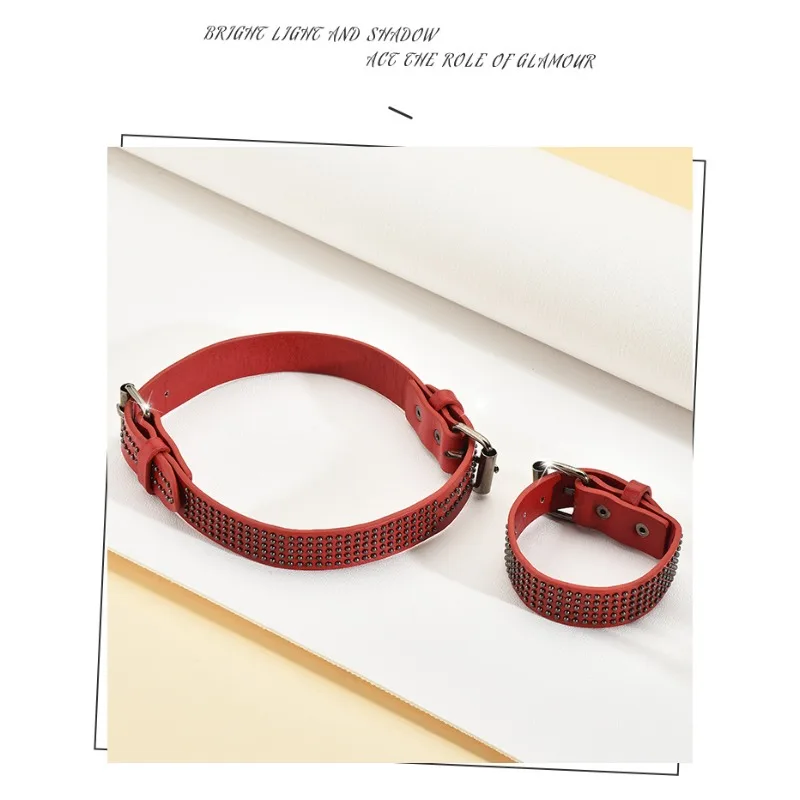 

A delicately designed red leather necklace, featuring heavy metal rivets and a detachable leather bracelet